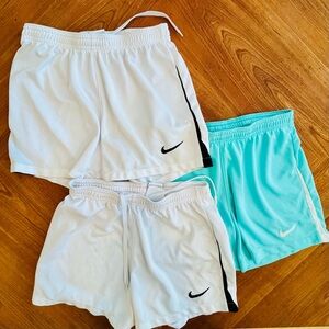 Nike Dri-Fit lot bundle of 3 soccer running shorts. 2 white 1 teal women’s Xs